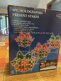 380884 New Outdoor Lighted Holographic Christmas Present Stakes 4 Piece Pathway Markers