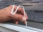 50 Count White Christmas Hook For Gutters With Mesh Leaf Guard. Fixed Price $22.00.