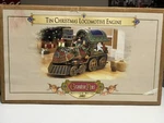 Grandeur Noel Collectors Edition Tin Christmas Locomotive 2002 New Box. Fixed Price $140.00.