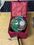 Christmas House Hand Painted Glass Ornament Green W/ Santa Holding Xmas Gift. Fixed Price $13.00.