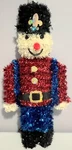Christmas House Tinsel Nutcracker Wall Decor 15" X 6.75". Fixed Price $13.99.