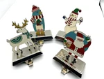 Wondershop 4PC Christmas Stocking Holders Santa Snowman Penguin Reindeer Set. Fixed Price $24.99.