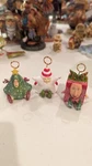 Set Of 4 Dept. 56 Christmas Kringles Placecard Holders - Different Designs. Fixed Price $20.00.