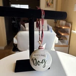 Large White Ceramic Christmas Ornament With Plaid Ribbon And Wood Dog Bone. Fixed Price $10.95.