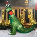 Holiday Time Inflatable Rex With Christmas Ornament And Santa Hat 8.5 Ft Tall. Fixed Price $119.99.