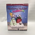 Costco New Picture Frame Christmas Stocking Holder With Color-changing Lights. Fixed Price $39.99.