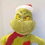Gemmy 19 Holiday Greeter Stuffed Grinch With Light-up Heart Green. Fixed Price $30.00.