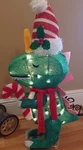 Holiday Time 25-INCH Light-up Plush Dinosaur Christmas Decoration.. Fixed Price $32.00.