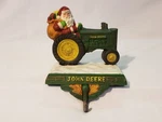 1999 John Deere Tractor Santa Stocking Holder Cast Iron. Fixed Price $20.00.