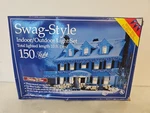 Holiday Time Swag-style String Lights, 150 Ice Blue Bulb White Wire 10 Ft. New. Fixed Price $16.99.