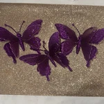 Three Purple Glittery Butterfly Clip Ornaments. Fixed Price $16.00.
