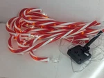 Set Of 12 Light Up Solar Powered Holiday Christmas Candy Cane Decor. Fixed Price $15.00.