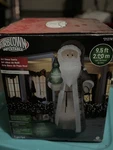 Gemmy 9.5-FT Lighted Art Deco Santa Christmas Inflatable. Fixed Price $230.00.