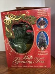 Kitech Musical Magic Growing Christmas Tree, Decorative Animated Open Box. Fixed Price $36.99.