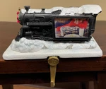 Hallmark Polar Express Steam Engine Train Christmas Stocking Hanger Photo Holder. Fixed Price $29.95.