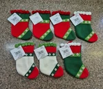 7.5" Decorative Stockings, Set Of 7, Red/green/white, Michaels Stores Brand, New. Fixed Price $25.00.