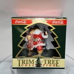 1995 Coca Cola Trim Tree Collection 1964 Christmas Ornament Santa Child Sitting. Fixed Price $8.90.