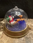 Blockbuster 1999 Santa Rudolph Spin Merry Whirl Christmas Ornament. Fixed Price $15.99.