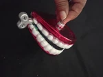 Old World Christmas Glass Blown Ornament, Wind Up Teeth 3"X2". Fixed Price $10.00.