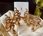 L'objet Napkin Rings Snake W/dark Blue Crystals Gold S/4 24K. Fixed Price $225.00.