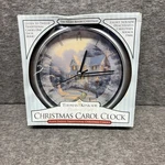 Thomas Kinkade Christmas Musical Wall Clock With 12 Traditional Carols 8". Fixed Price $21.00.