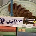 Vintage Miniature Style String-a-long Christmas 35 Set Assorted. Fixed Price $17.09.