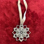 Silver Tone Multi Layered Snowflake Christmas Ornament With White Ribbon Hanging. Fixed Price $8.04.