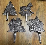 Set Of 4 Vtg Grandeur Noel Cast Iron Christmas Stocking Holders Santa Tree. Fixed Price $65.89.