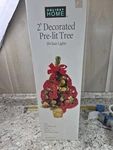 Holiday Home 2FT Pre-lit Decorated Christmas Tree 20 Clear Lights Artificial 24". Fixed Price $13.58.