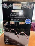 Gemmy Orchestra Of Lights Color Changing Candy Cane Pathway Arches New. Fixed Price $223.25.