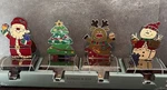 New 4 Christmas Enamel Stocking Hangers W/ Heavy Chrome Base Santa Tree Snowman. Fixed Price $34.99.