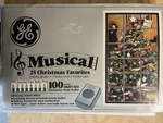 Ge Musical Light Set 100 Asst Colors 25 Christmas Songs Twinkling Blinking. Fixed Price $149.99.