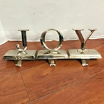 Northlight Set Of 3 Shiny Silver Beveled Joy Christmas Stocking Holders Hangers. Fixed Price $19.99.