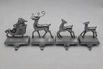 4 Brushed Cast Aluminum Reindeer Christmas Stocking Hangers Silver Holiday Decor. Fixed Price $17.97.