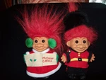 Two Vintage Troll Dolls, One Christmas Caroler And English Queens Guard. Fixed Price $19.99.