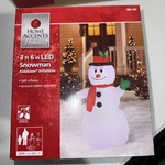 6.6 Snowman With Gift Box Lighted Christmas Inflatable Home Accents Holiday. Fixed Price $13.00.