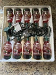 Holiday Time 10 Santas Indoor Glass Light Set Connects At One End. Fixed Price $18.95.