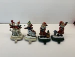 Hand Painted Christmas Stocking Holders Set Of 4 Cast Iron Santas, Snowmen Read. Fixed Price $14.00.