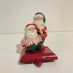 Vtg 1994 Potpourri Christmas Adjustable Santas Stocking With Cast Iron Bottom. Fixed Price $29.00.