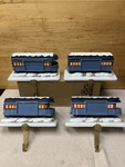 Lot Of 4 Hallmark Polar Express Stocking Hanger Photo Passenger Train Caboose. Fixed Price $120.00.