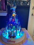 Disney Animated Christmas Castle With Lights And Holiday Music Shown. Fixed Price $179.00.