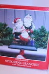 Potpourri Christmas Stocking Hanger Holder 3 Santas W/ Packages Cast Iron. Fixed Price $24.95.