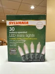 Sylvania 30 Christmas Led Mini Lights Battery Operate, Warm White Automatic Time. Fixed Price $12.99.