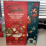 Box Candiy Totally Santa's Sleigh Ornament Set, New In. Fixed Price $11.91.