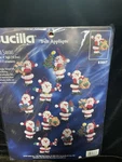 1997 Bucilla Kit 83667 Felt Sequin Christmas Ornaments Little Santas Makes 16. Fixed Price $29.99.