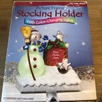 Costco Picture Frame Christmas Stocking Holder With Color-changing Lights. Fixed Price $30.00.