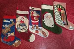 16"X6" - Vintage Needlepoint Christmas Santa, Sleigh, Village Stockings Unmarked. Fixed Price $249.00.