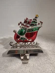 Sleigh With Presents Stocking Hanger, Colored Enamel, December Home. Fixed Price $10.00.