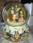 Grandeur Noel We Wish You Merry Christmas Revolving 8" Tall Musical Snow Globe. Fixed Price $45.00.