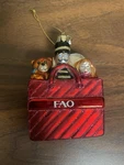 Fao Schwarz Christmas Ornament Shopping Bag Of Toys 4IN Glass. Fixed Price $8.95.